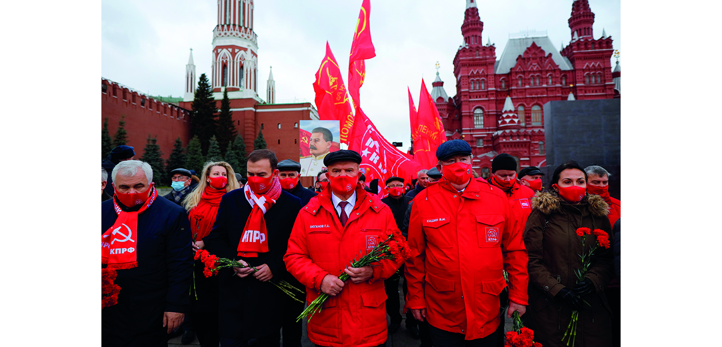 Russian communists march in Red Square to honour the October Revolution